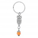 Porte-clés hibou argenté et perle à facettes orange
