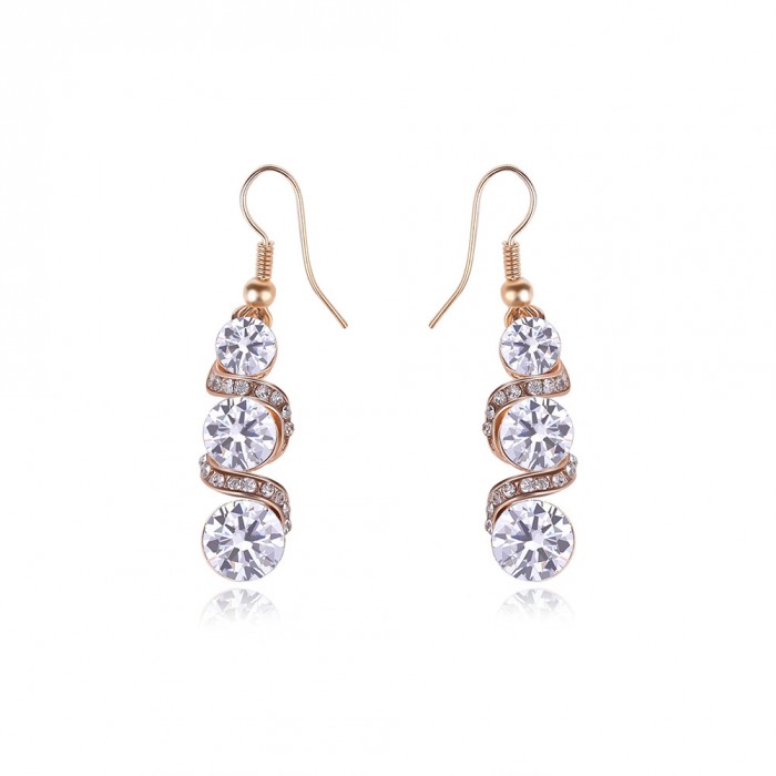 Boucles d'oreilles spirale dorée strass
