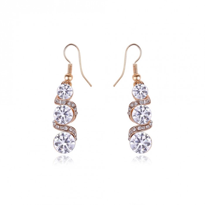 Boucles d'oreilles spirale dorée strass