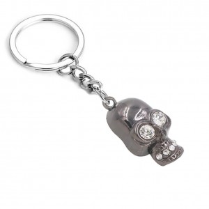 Porte-clés tête de mort noire yeux strass Porte-clés tête de mort noire yeux strass